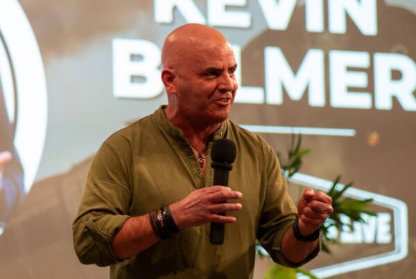 Kevin Bulmer delivering a keynote on brand story and strategy, focusing on leadership values and authenticity.