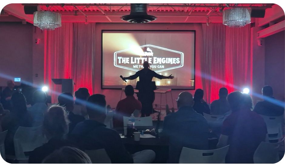 Motivational speaker Kevin Bulmer using a lighthouse metaphor at Little Engines LIVE to inspire teams to navigate change with courage.