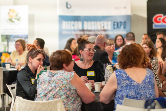 A diverse group of business professionals engaged in an interactive roundtable discussion during the Little Engines LIVE mastermind.